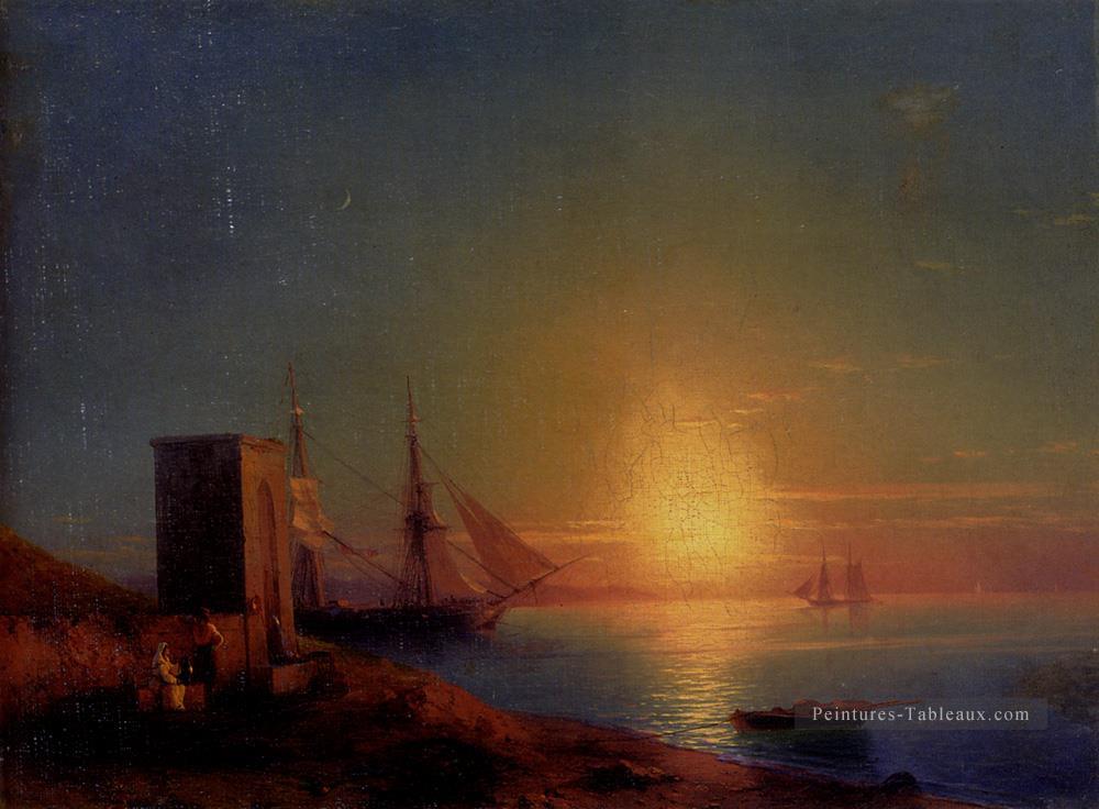 Aivazoffski Ivan Konstantinovich Figures dans un paysage côtier au coucher du soleil Ivan Aivazovsky Peintures à l'huile